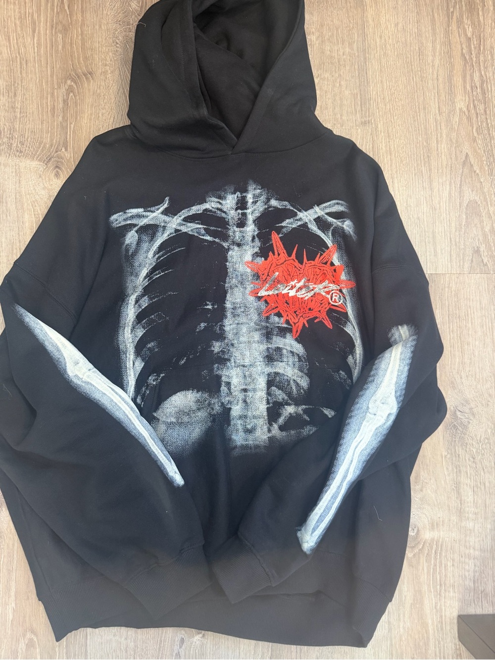 Loiter Black Graphic Hoodie with Ribcage Print and Red Accent